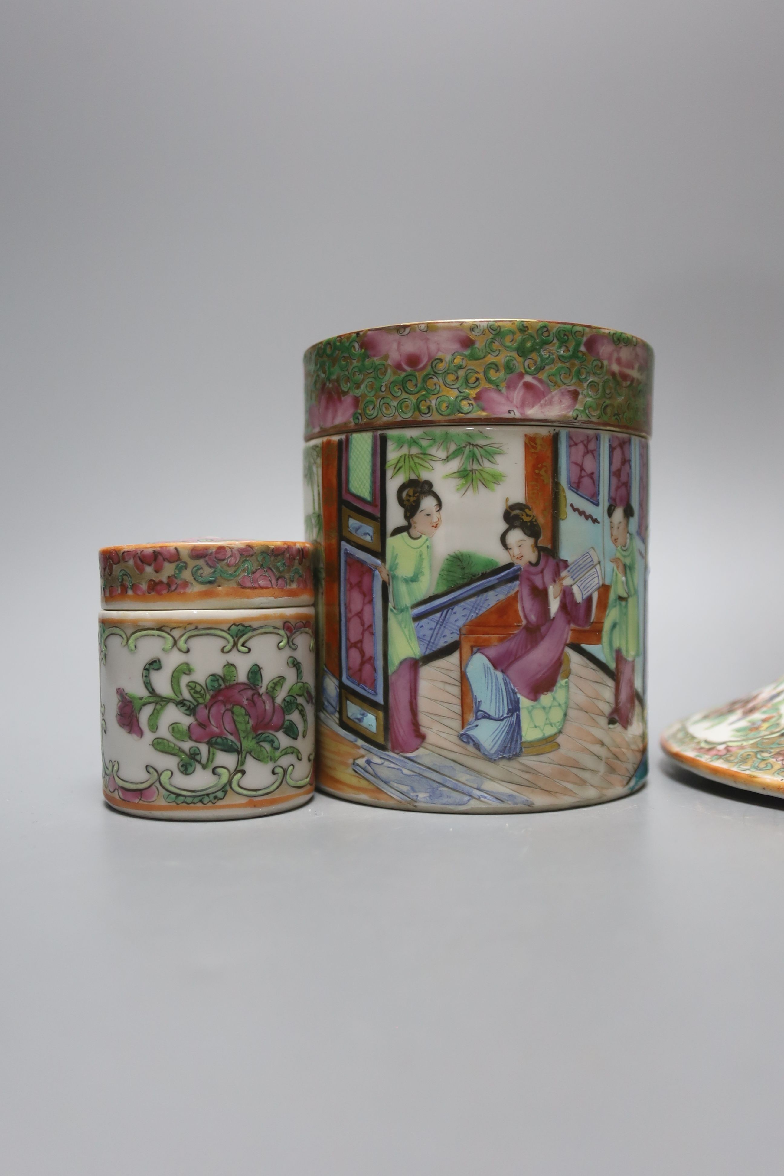 A Chinese Canton famille rose nest of boxes and covers, a similar candlestick and a tray 23cm